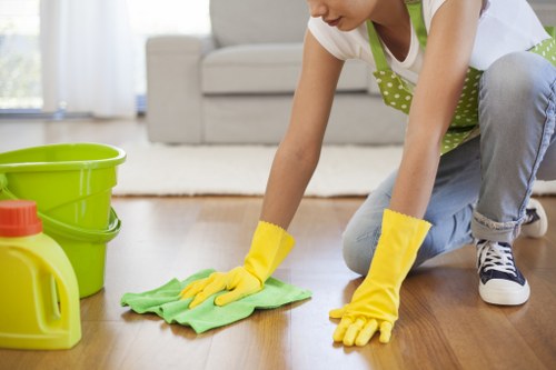 Local upholstery cleaner treating a stained armchair in Wimbledon